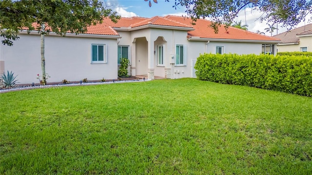 1753 Aspen Ln, Weston, FL 33327 - mediterranean / spanish house with a tile roof, a front lawn, and stucco siding