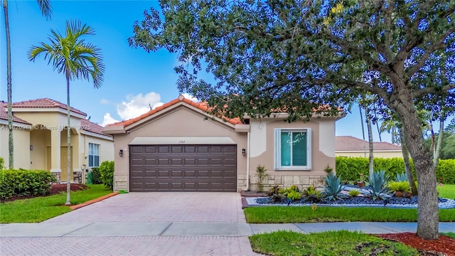 1753 Aspen Ln, Weston, FL 33327 - view of front of property with driveway, a garage, stucco siding, and stone siding