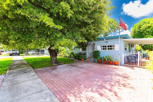 7110 SW 13th Ter, Miami, FL 33144 - view of front of home with a front lawn and stucco siding