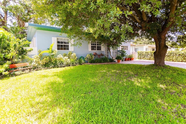 7110 SW 13th Ter, Miami, FL 33144 - view of front facade with a front lawn and stucco siding