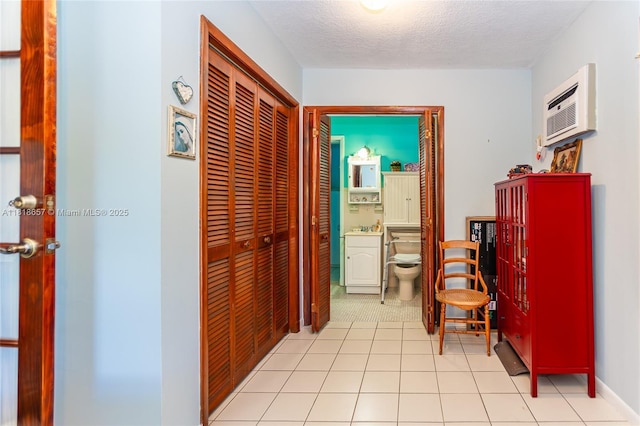 7110 SW 13th Ter, Miami, FL 33144 - hall featuring an AC wall unit and a textured ceiling