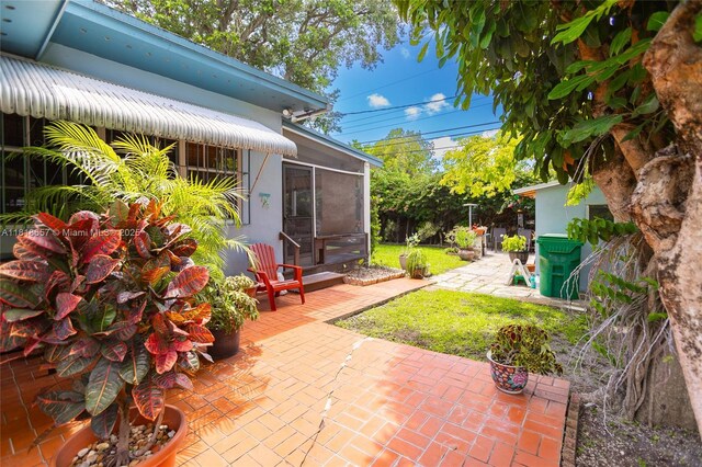 7110 SW 13th Ter, Miami, FL 33144 - view of patio with a sunroom