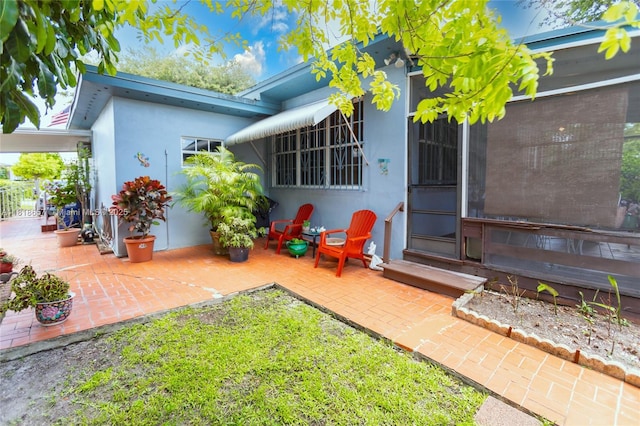 7110 SW 13th Ter, Miami, FL 33144 - rear view of house with a patio and stucco siding
