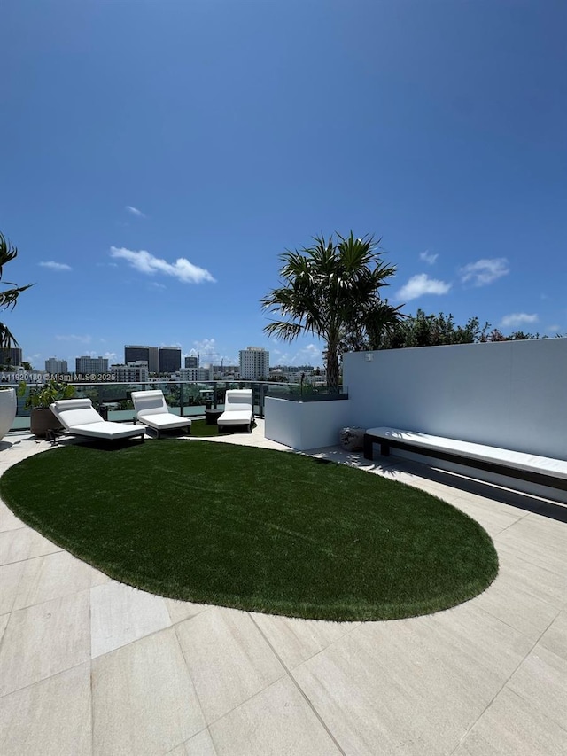 9901 W Bay Harbour Dr Unit 605, Bay Harbor Islands, FL 33154 - view of green lawn featuring a city view