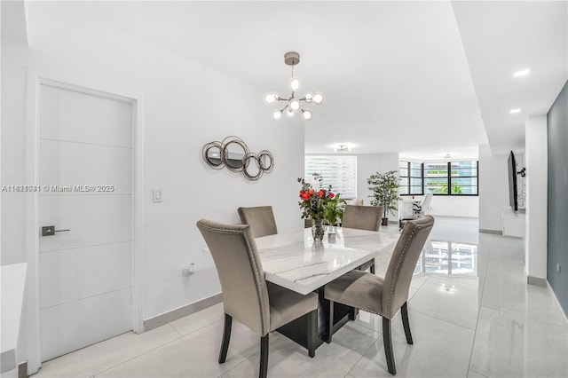999 Brickell Bay Dr Unit 711, Miami, FL 33131 - dining space with a chandelier and light tile patterned flooring