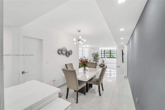 999 Brickell Bay Dr Unit 711, Miami, FL 33131 - dining room with a chandelier, light tile patterned floors, and recessed lighting