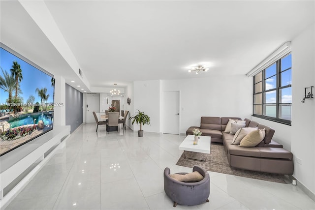 999 Brickell Bay Dr Unit 711, Miami, FL 33131 - living room featuring a chandelier and light tile patterned floors