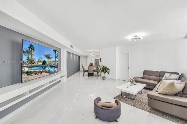 999 Brickell Bay Dr Unit 711, Miami, FL 33131 - tiled living room with a chandelier and baseboards