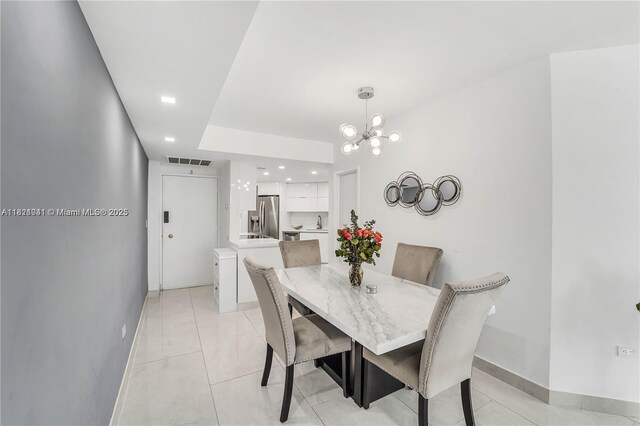 999 Brickell Bay Dr Unit 711, Miami, FL 33131 - dining room featuring a chandelier, light tile patterned flooring, and recessed lighting