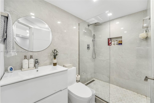 999 Brickell Bay Dr Unit 711, Miami, FL 33131 - bathroom with tile walls, vanity, and walk in shower