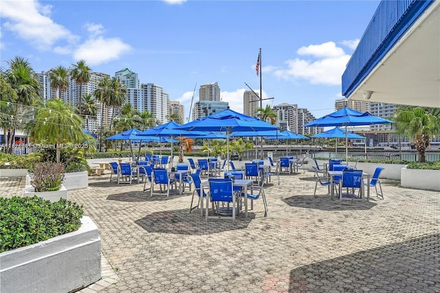999 Brickell Bay Dr Unit 711, Miami, FL 33131 - view of patio with outdoor dining area and a view of city