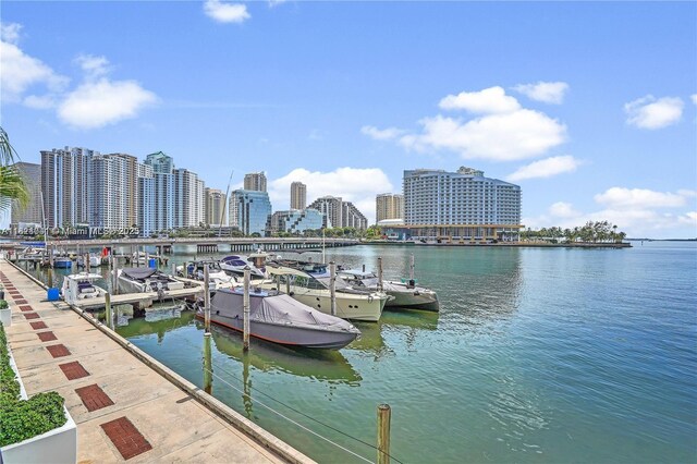 999 Brickell Bay Dr Unit 711, Miami, FL 33131 - dock featuring a water view and a view of skyline