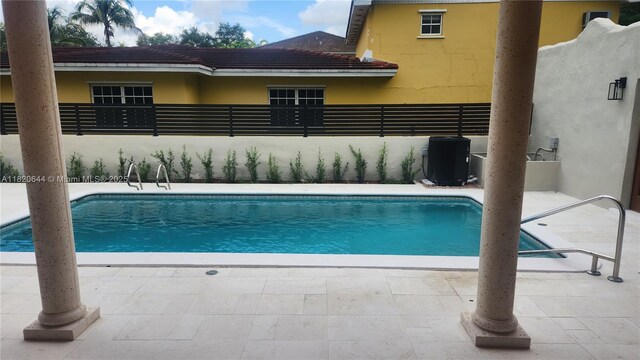 85 Deer Run, Miami Springs, FL 33166 - view of swimming pool with a patio area