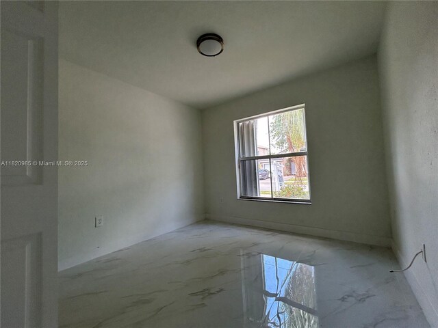 1507 SE 20th Rd, Homestead, FL 33035 - spare room with light marble finish flooring and baseboards