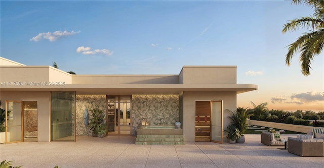 2901 NE 9th Ct Unit 6A, Fort Lauderdale, FL 33384 - patio terrace at dusk with a patio, a hot tub, and outdoor lounge area
