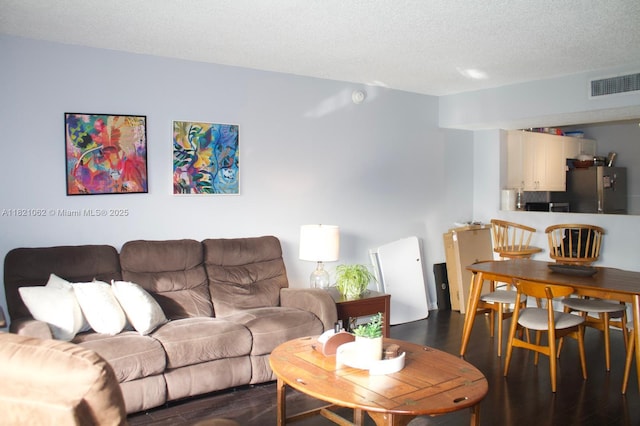 8015 SW 107th Ave Unit 220, Miami, FL 33173 - living room featuring dark wood-style floors and a textured ceiling