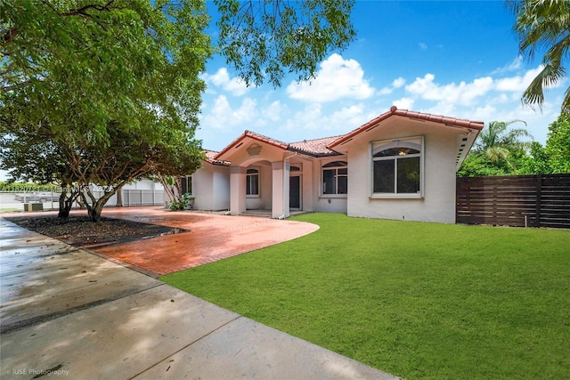 17050 SW 90th Ave, Palmetto Bay, FL 33157 - mediterranean / spanish-style house featuring stucco siding, a tiled roof, and driveway
