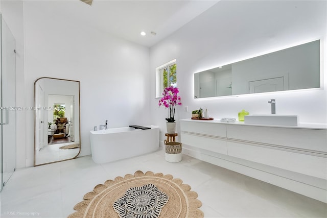 17050 SW 90th Ave, Palmetto Bay, FL 33157 - bathroom featuring vanity, a soaking tub, and recessed lighting