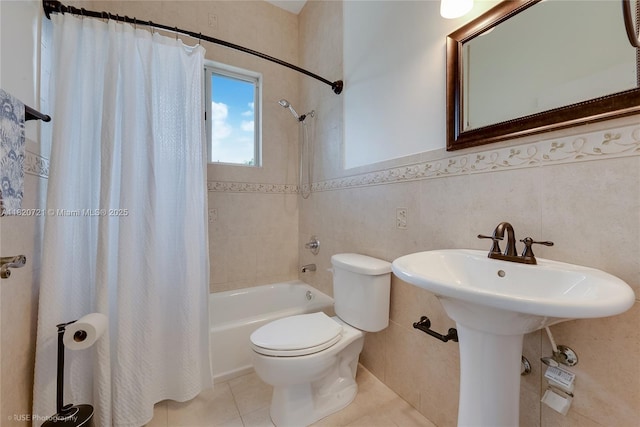 17050 SW 90th Ave, Palmetto Bay, FL 33157 - bathroom featuring shower / bathtub combination with curtain, tile patterned floors, tile walls, and wainscoting
