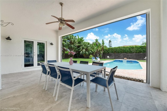 17050 SW 90th Ave, Palmetto Bay, FL 33157 - fenced backyard featuring a patio area, french doors, a ceiling fan, and outdoor dining space
