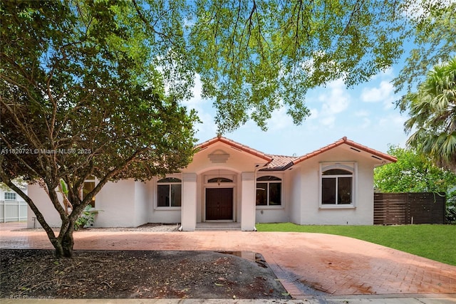 17050 SW 90th Ave, Palmetto Bay, FL 33157 - mediterranean / spanish-style home with a tile roof and stucco siding