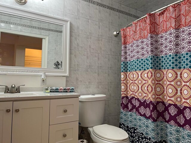 3338 Taft St, Hollywood, FL 33021 - bathroom featuring tile walls, vanity, and a shower with curtain