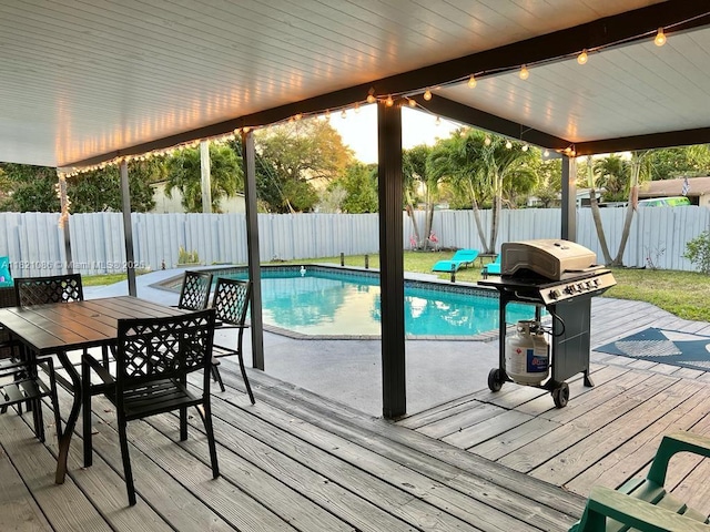 3338 Taft St, Hollywood, FL 33021 - view of swimming pool featuring grilling area, a fenced backyard, a deck, and outdoor dining area