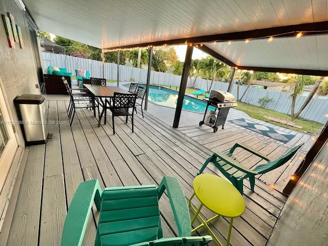 3338 Taft St, Hollywood, FL 33021 - deck featuring a grill, a fenced backyard, and outdoor dining area