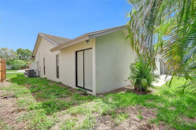 8511 NW 51st Ct, Lauderhill, FL 33351 - view of side of home featuring stucco siding and a central AC unit