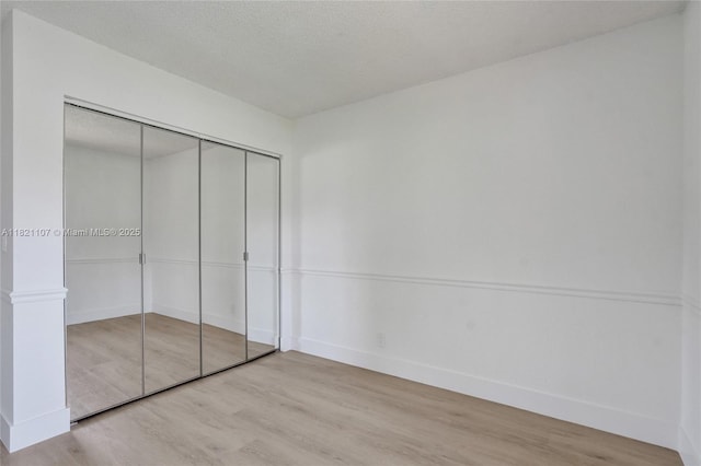 8511 NW 51st Ct, Lauderhill, FL 33351 - unfurnished bedroom with wood finished floors and a closet