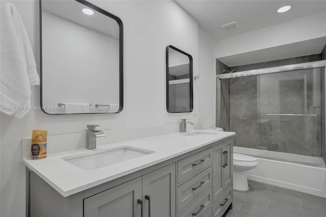 8511 NW 51st Ct, Lauderhill, FL 33351 - bathroom with double vanity, shower / bath combination with glass door, recessed lighting, and tile patterned floors