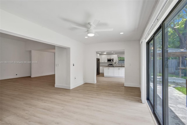 8511 NW 51st Ct, Lauderhill, FL 33351 - unfurnished living room featuring light wood-style floors, ceiling fan, and recessed lighting