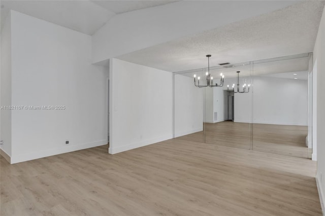 8511 NW 51st Ct, Lauderhill, FL 33351 - unfurnished room featuring a chandelier, light wood-style floors, and lofted ceiling
