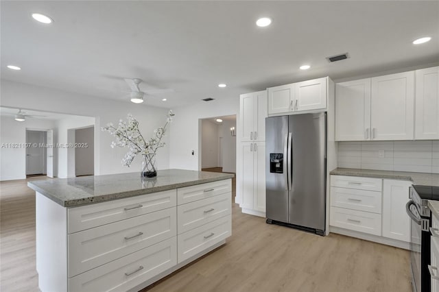 8511 NW 51st Ct, Lauderhill, FL 33351 - kitchen featuring appliances with stainless steel finishes, a ceiling fan, white cabinetry, light stone countertops, and recessed lighting