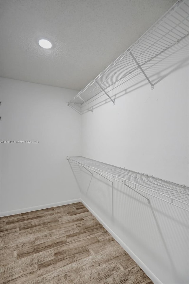 8511 NW 51st Ct, Lauderhill, FL 33351 - spacious closet featuring wood finished floors