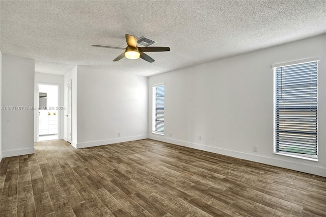 8511 NW 51st Ct, Lauderhill, FL 33351 - empty room featuring a ceiling fan, dark wood-type flooring, and a textured ceiling