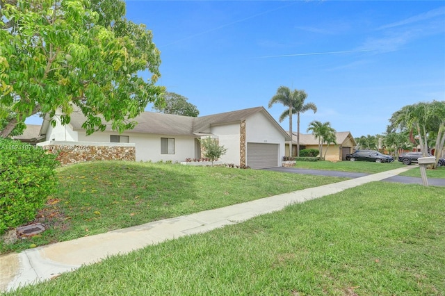 8511 NW 51st Ct, Lauderhill, FL 33351 - view of front of home with asphalt driveway, a front yard, stucco siding, and a garage