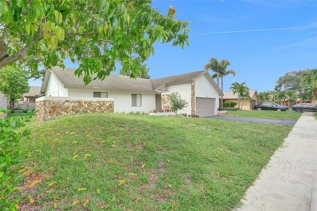 8511 NW 51st Ct, Lauderhill, FL 33351 - view of front facade featuring stucco siding, driveway, a front lawn, and a garage