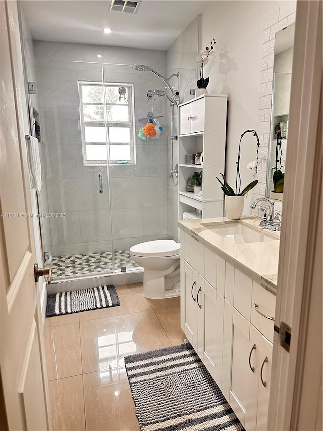 3250 NW 174th St, Miami Gardens, FL 33056 - bathroom featuring a stall shower, vanity, and tile patterned flooring
