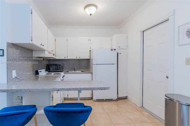 1300 Salzedo St Unit 4, Coral Gables, FL 33134 - kitchen with white appliances, crown molding, decorative backsplash, white cabinetry, and light tile patterned flooring