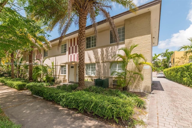 1300 Salzedo St Unit 4, Coral Gables, FL 33134 - view of front facade featuring stucco siding and brick siding