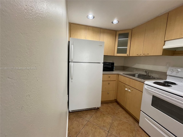 8603 SW 68th Ct Unit 27, Pinecrest, FL 33156 - kitchen featuring white appliances, under cabinet range hood, light tile patterned floors, light countertops, and glass insert cabinets