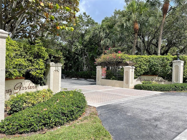 8603 SW 68th Ct Unit 27, Pinecrest, FL 33156 - gate with view of wooded area