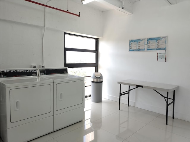 575 Crandon Blvd Unit 706, Key Biscayne, FL 33149 - shared laundry room featuring separate washer and dryer and light tile patterned flooring