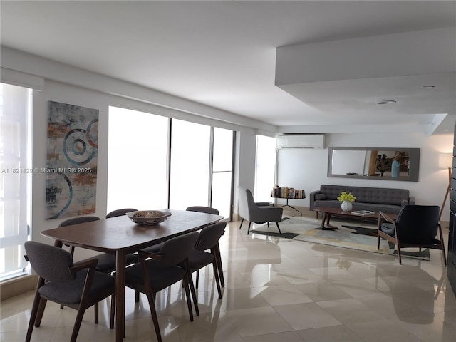 575 Crandon Blvd Unit 706, Key Biscayne, FL 33149 - dining room featuring a wall mounted air conditioner and light tile patterned floors