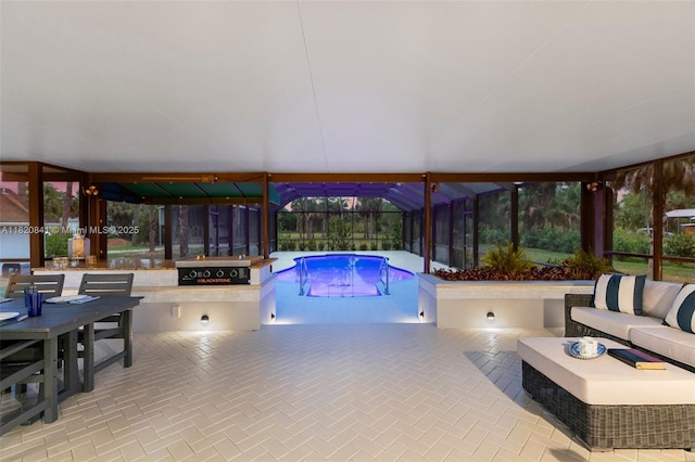 1020 SW 19th St SW, Naples, FL 34117 - indoor pool featuring outdoor lounge area, grilling area, a patio, and glass enclosure