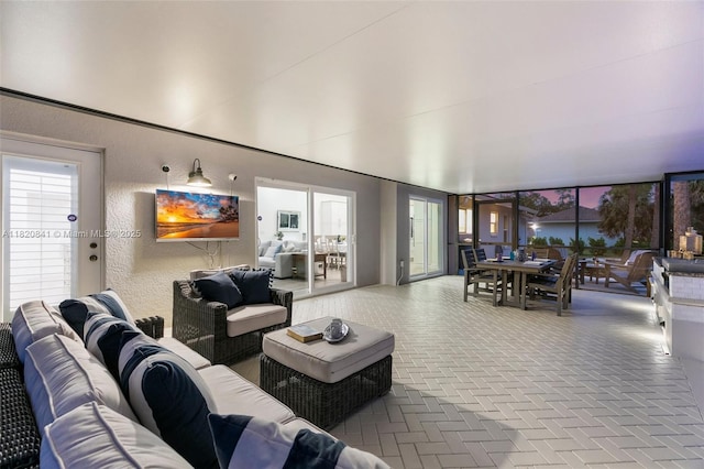 1020 SW 19th St SW, Naples, FL 34117 - living room featuring brick floors