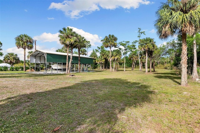 1020 SW 19th St SW, Naples, FL 34117 - view of green lawn with a detached carport