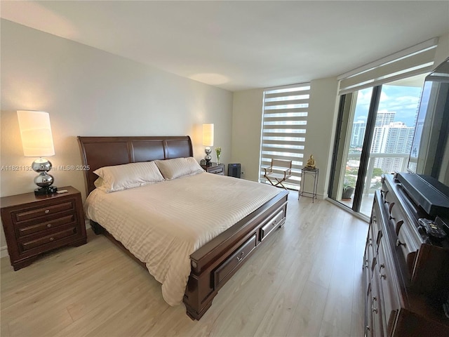 20191 E Country Club Dr Unit 1903, Aventura, FL 33180 - bedroom with light wood-style flooring, floor to ceiling windows, and access to exterior