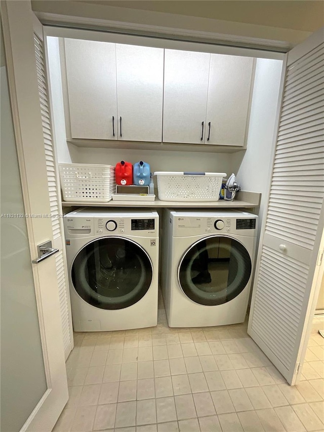 20191 E Country Club Dr Unit 1903, Aventura, FL 33180 - laundry area with separate washer and dryer, cabinet space, and light tile patterned flooring